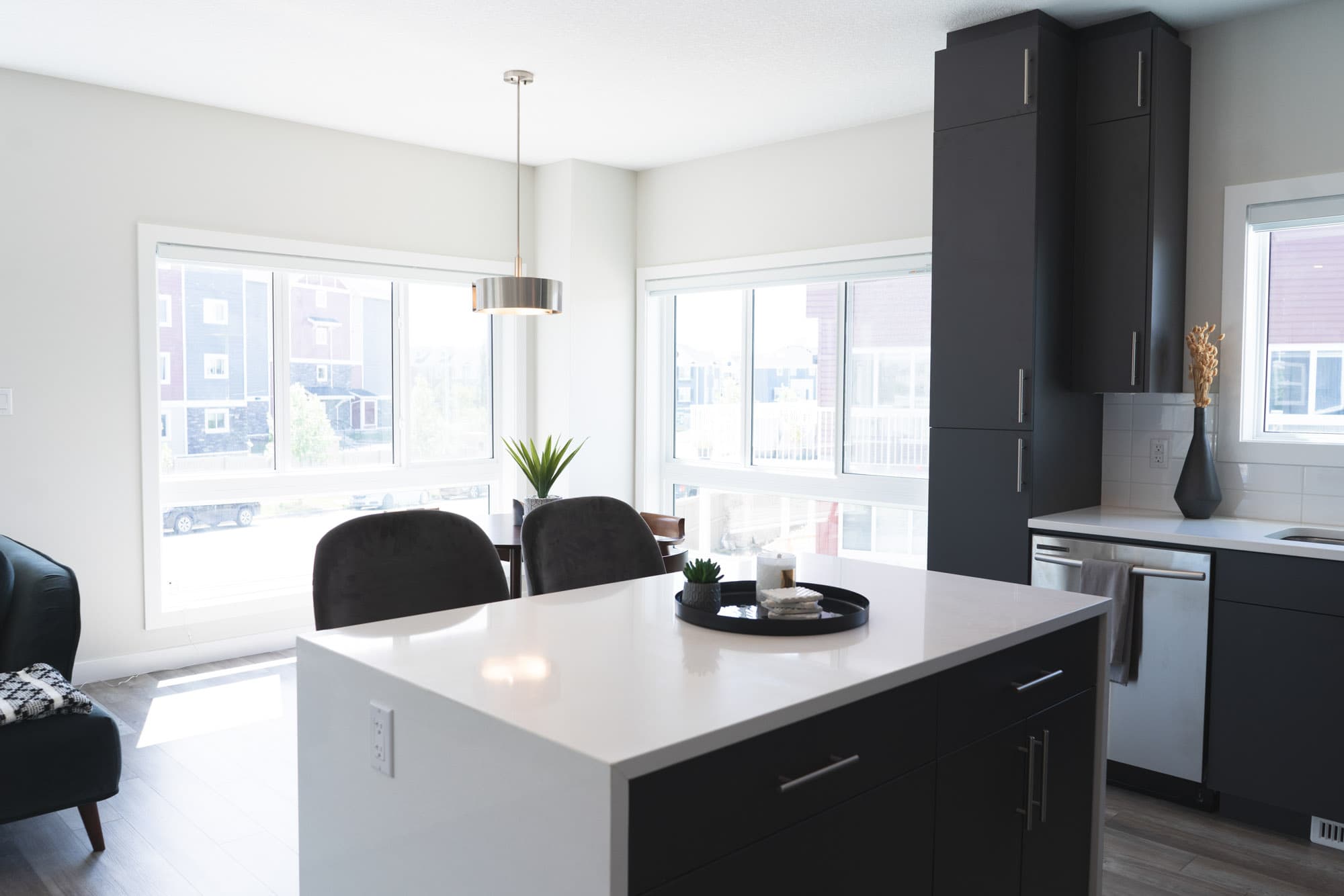 Townhome kitchens typically include ample cabinet space for storage. These cabinets may come in a variety of finishes and styles, ranging from traditional to modern. Some townhomes may feature tall cabinets reaching up to the ceiling, maximizing storage capacity.